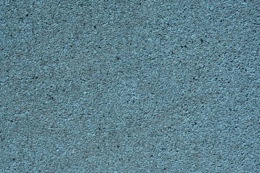 Renkli kauçuk kaplama mavi bir arka plan görüntüsü. Yıpranmış spor alan kapak