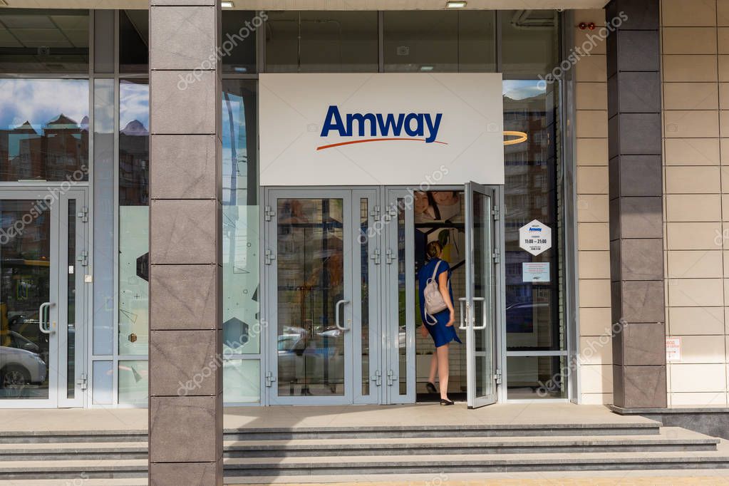 August 23, 2018. Krasnoyarsk. Russia. The office of the company Amway. Woman opens door and comes in