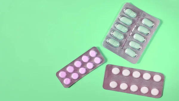 Blisters Different Pills Green Background Copy Space Text — Stock Photo, Image
