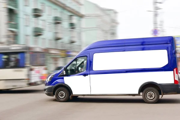Blue cargo van travels fast along the road. copy space mock up for your text advertising — Stock Photo, Image