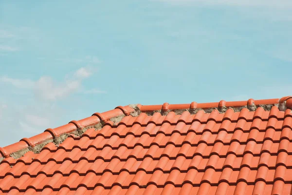tile roof on the background of the bare sky. copy space for your text