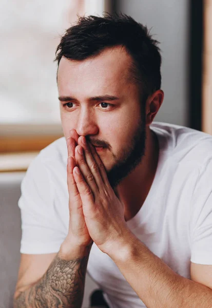 Portrait Worried Young Man Prays Stress Concept Man Tattoo Hand — Stock Photo, Image