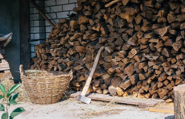 Ax in the background of firewood. The place for the felling of firewood — Stock Photo, Image