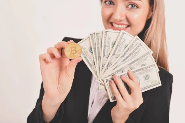 bit-coin business concept. Beautiful businesswoman is counting her money. Young business are enjoying the money and earning. Young business are happy and is saving money with the bitcoin