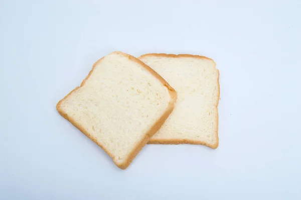 stock image cutting wheat bread  isolated on a white background