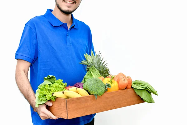 Concepto de entrega. Repartidor sosteniendo una bolsa de aislados de comestibles —  Fotos de Stock