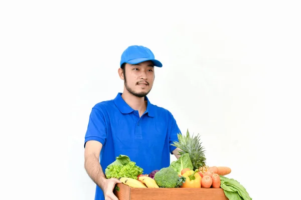 Concepto de entrega. Repartidor sosteniendo una bolsa de aislados de comestibles —  Fotos de Stock