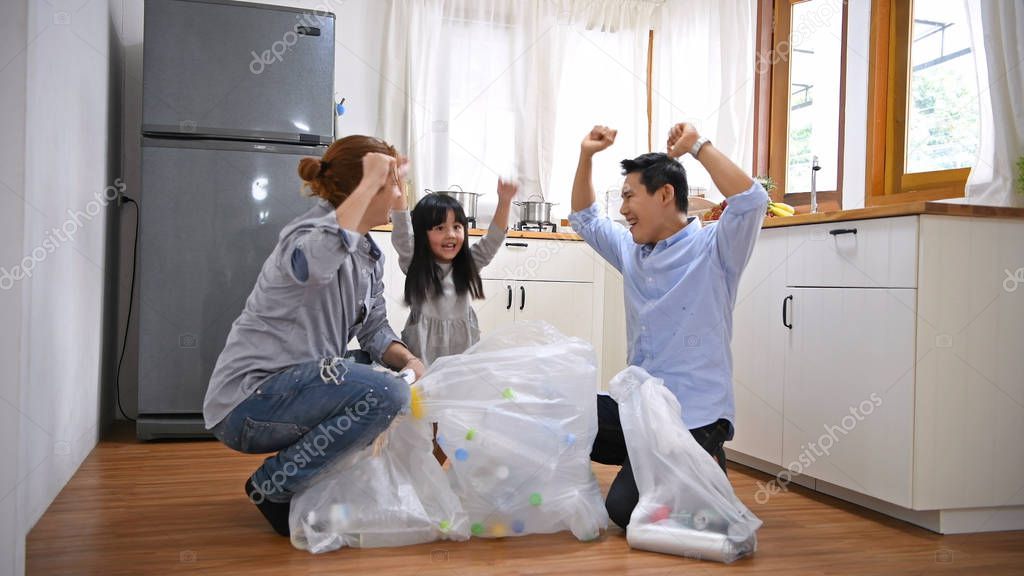 Family concept. The family helped with the garbage collection su