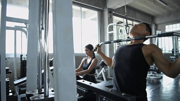 Exercise concept. Young people are playing weightlifting sports 