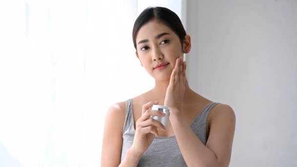 Beauty Concept Asian Girl Applying Cream Her Face — Stock Video