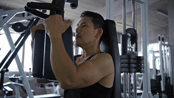 Sports concept. Male athletes are building strong chest muscles.