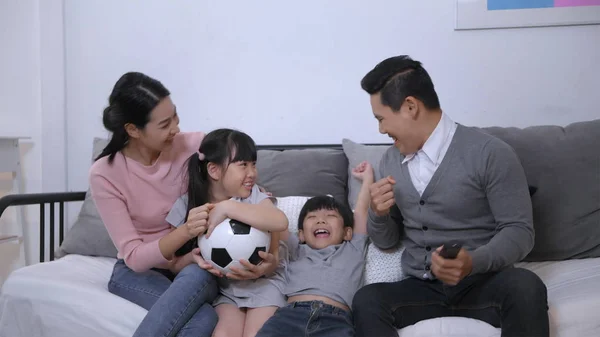 Family concept. Parents and children cheering football together — Stock Photo, Image