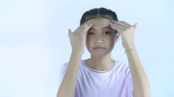 Beauty concept. Young girl applying cream on a white background. — Stock Photo, Image