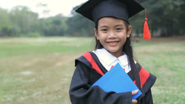 Educational Concepts Girl Wearing Graduation Dress Happy Garden Resolution — Stock Video