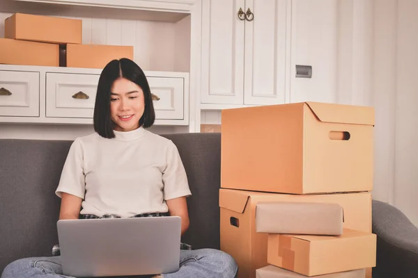 Sme business concept. Young Asian people are packing their packa — home, shipping - Stock Photo | #182976846