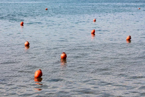 Multiple Small Orange Buoys Left Local Fishermen Floating Calm Blue — Stock Photo, Image