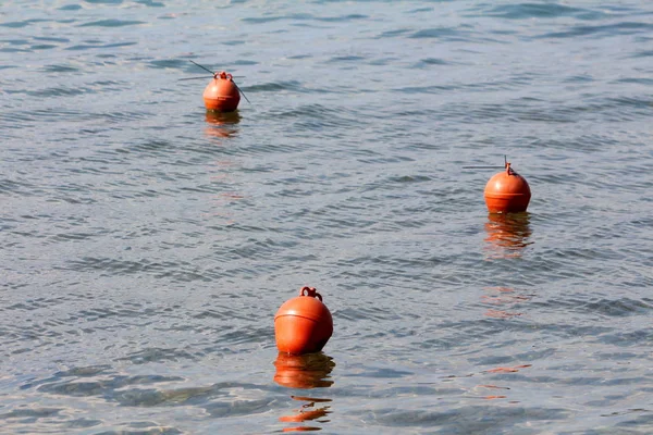 Three Small Orange Buoys Left Local Fishermen Floating Calm Blue — Stock Photo, Image