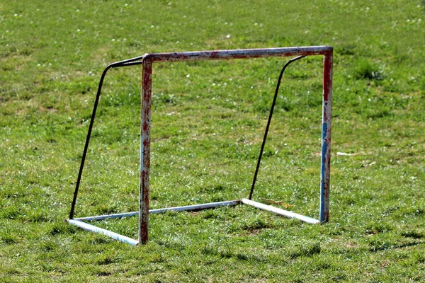 Rusted Heavily Used Old Metal Goal Post Surrounded Uncut Grass Stock Picture