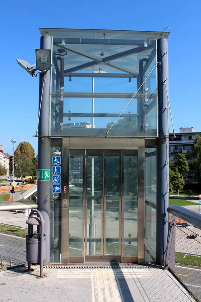 Entrance Glass Elevator Platform Side Train Station Surrounded Buildings Street Stock Photo