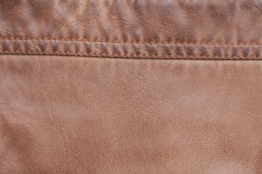 Kahverengi zemin deri dikişli dikiş doku.