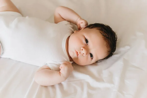 Close View Cute Newborn Baby White Bodysuit Lying Bed — Stock Photo, Image