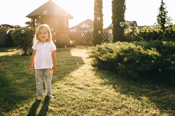 Cute Little Blond Child Looking Camera While Standing Backyard — Stock Photo, Image