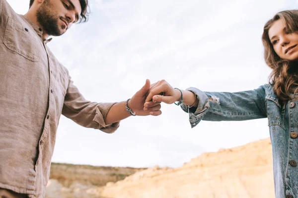 Young Stylish Couple Holding Hands Together — Free Stock Photo