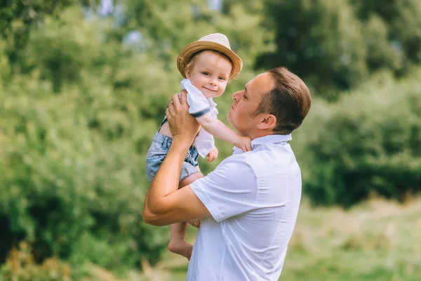 Happy Father Holding Adorable Baby Boy Hands — Stock Photo, Image