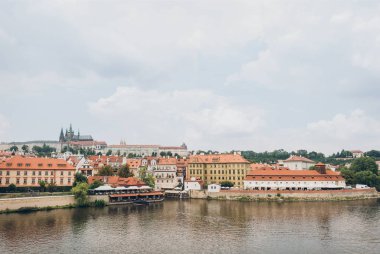 beautiful Vltava river and architecture in prague, czech republic  clipart