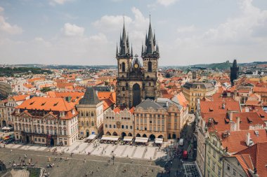 PRAGUE, CZECH REPUBLIC - JULY 23, 2018: aerial view of famous old town square with tourists and beautiful prague cityscape clipart