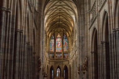 PRAGUE, CZECH REPUBLIC - JULY 23, 2018: beautiful ancient stained glass windows inside st vitus cathedral in prague, czech republic  clipart