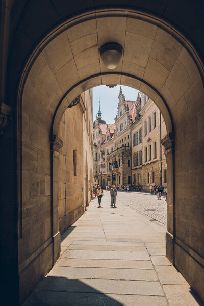 PRAGUE, CZECH REPUBLIC - JULY 23, 2018: archway and people walking on street in old town, prague, czech republic