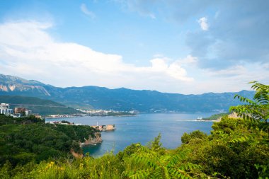 landscape of adriatic sea and coastal town in Budva, Montenegro clipart