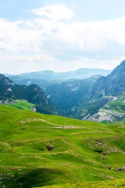 landscape of green valley and mountains in Durmitor massif, Montenegro 