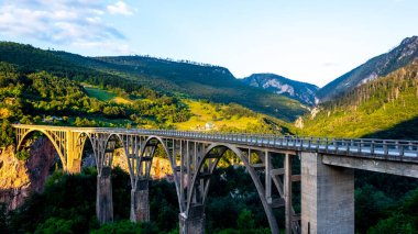 Tara Bridge and beautiful mountains in Montenegro clipart