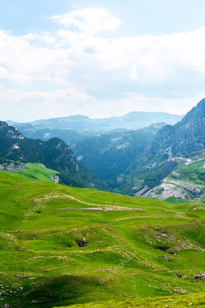landscape of green valley and mountains in Durmitor massif, Montenegro 