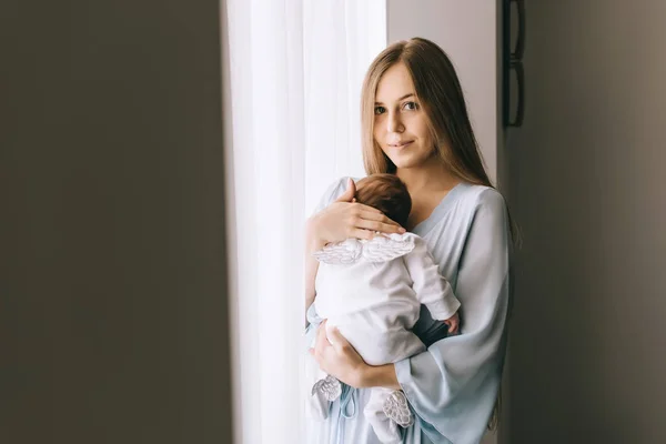 Selective Focus Mother Carrying Little Baby Boy Front Curtains — Stock Photo, Image