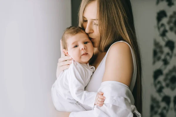 Mother Kissing Little Baby Boy Front Curtains Home — Stock Photo, Image