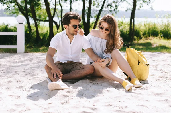 Happy couple spending weekend on sandy city beach — Stock Photo