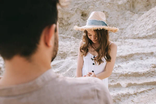 Beautiful young couple in sand canyon, selective focus — Stock Photo