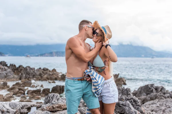 Boyfriend kissing girlfriend at beach in Montenegro — Stock Photo