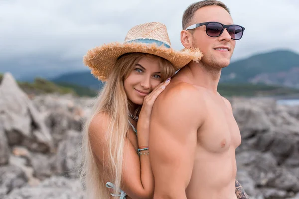 Portrait of girlfriend touching shirtless boyfriend at beach in Montenegro — Stock Photo