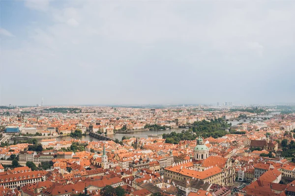 Aerial view of beautiful prague cityscape with old buildings, Charles Bridge and Vltava river — Stock Photo