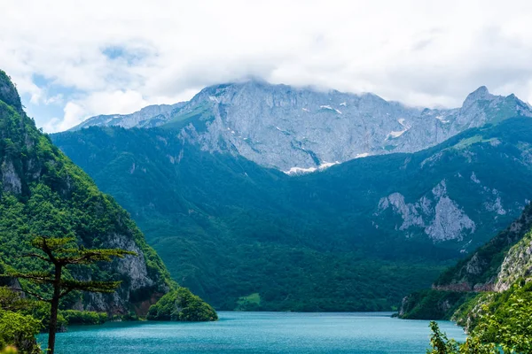 Beautiful Piva Lake, mountains and clouds in Montenegro — Stock Photo