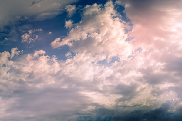 Pink and blue dramatic sky with sunrays