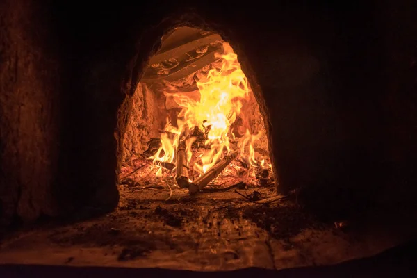 Traditional rural fireplace in eastern Europe for heating the home at winter — Stock Photo, Image