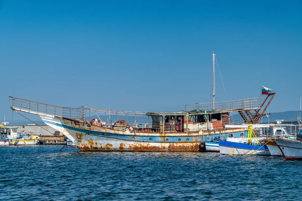Old rusted Fishing Boat docked at a harbor port in Nessebar anci