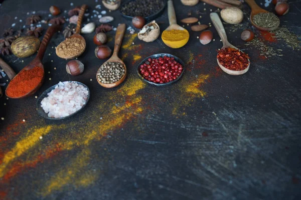 Various Indian Spices Wooden Spoons Herbs Nuts Dark Stone Table — Stock Photo, Image