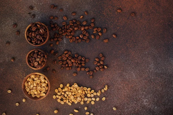 Three Different Varieties Fresh Roasted Coffee Beans Bowls Dark Stone — Stock Photo, Image