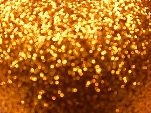 Abstrait fond d'or doux flou guirlande lumières de Noël — Photo